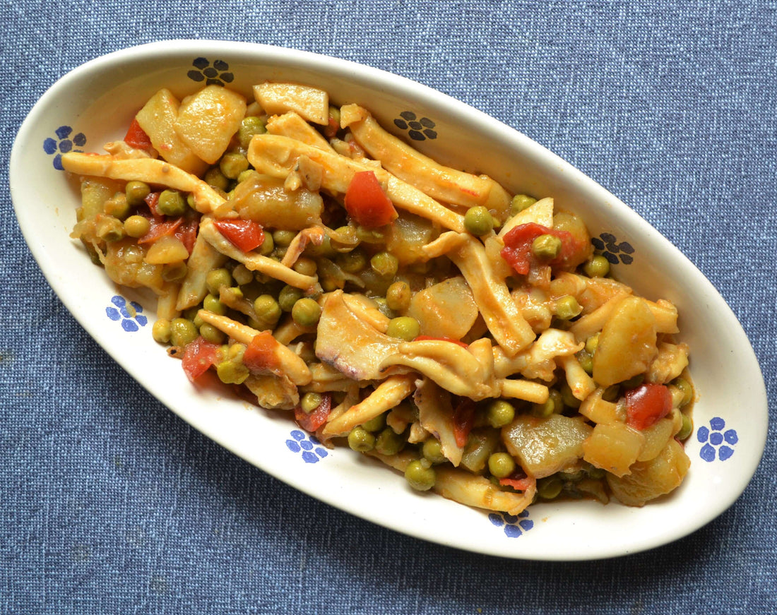 Seppie con patate e piselli