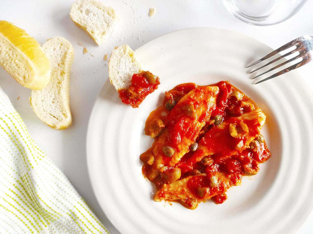 Filetti di San Pietro al sugo di olive e capperi