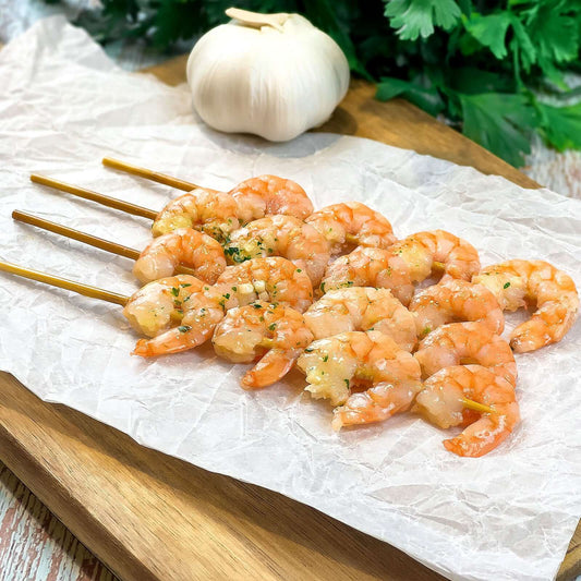 Spiedini di mazzancolle, aglio e prezzemolo