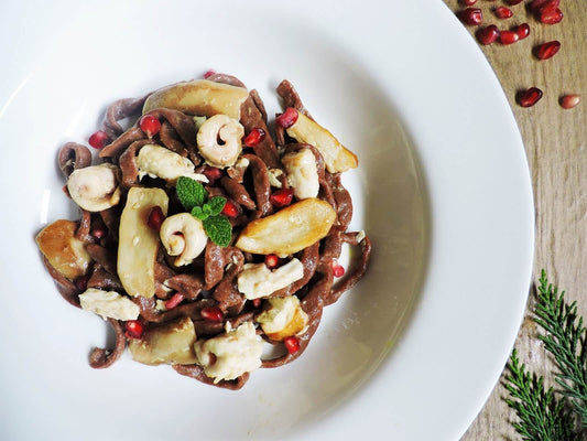 Tagliatelle alla farina di castagne e cacao con palombo, porcini e melograno